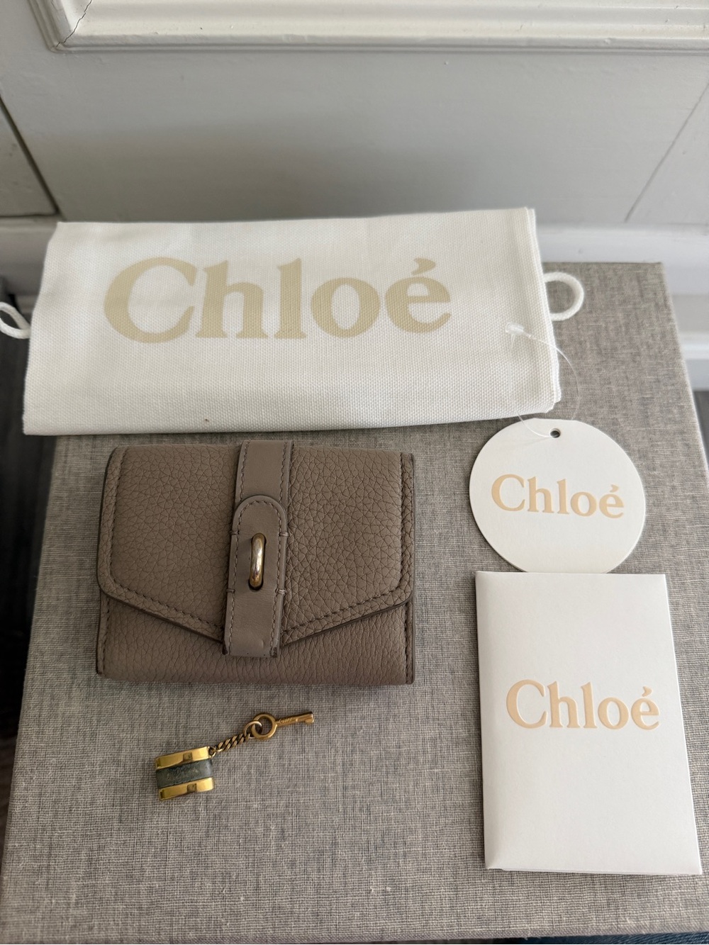 Chloé Pebbled Leather Trifold Wallet in Taupe